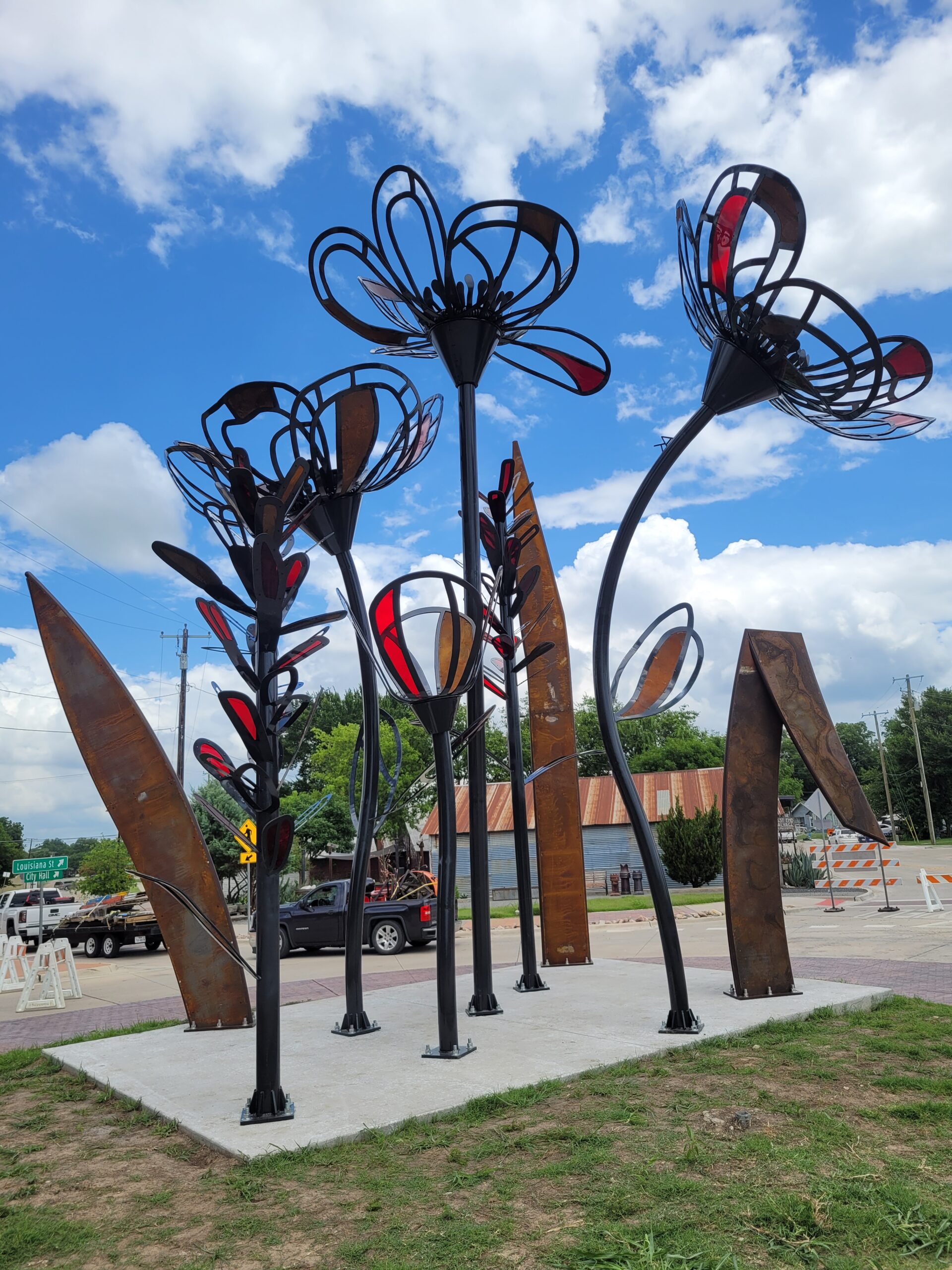 McKinney custom fabricated metal flower roundabout sculpture
