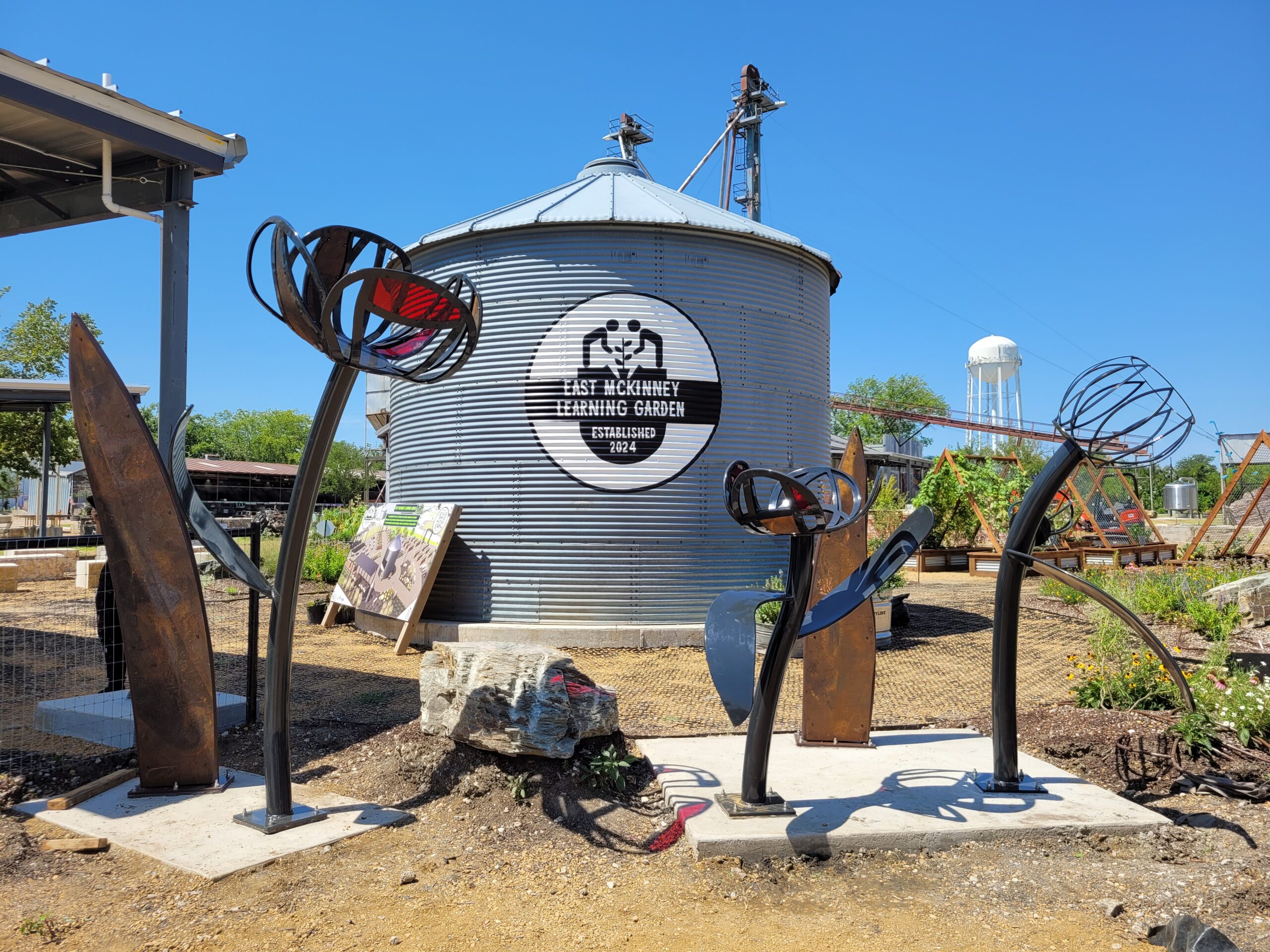 East McKinney learning garden custom steel metal flower sculpture.