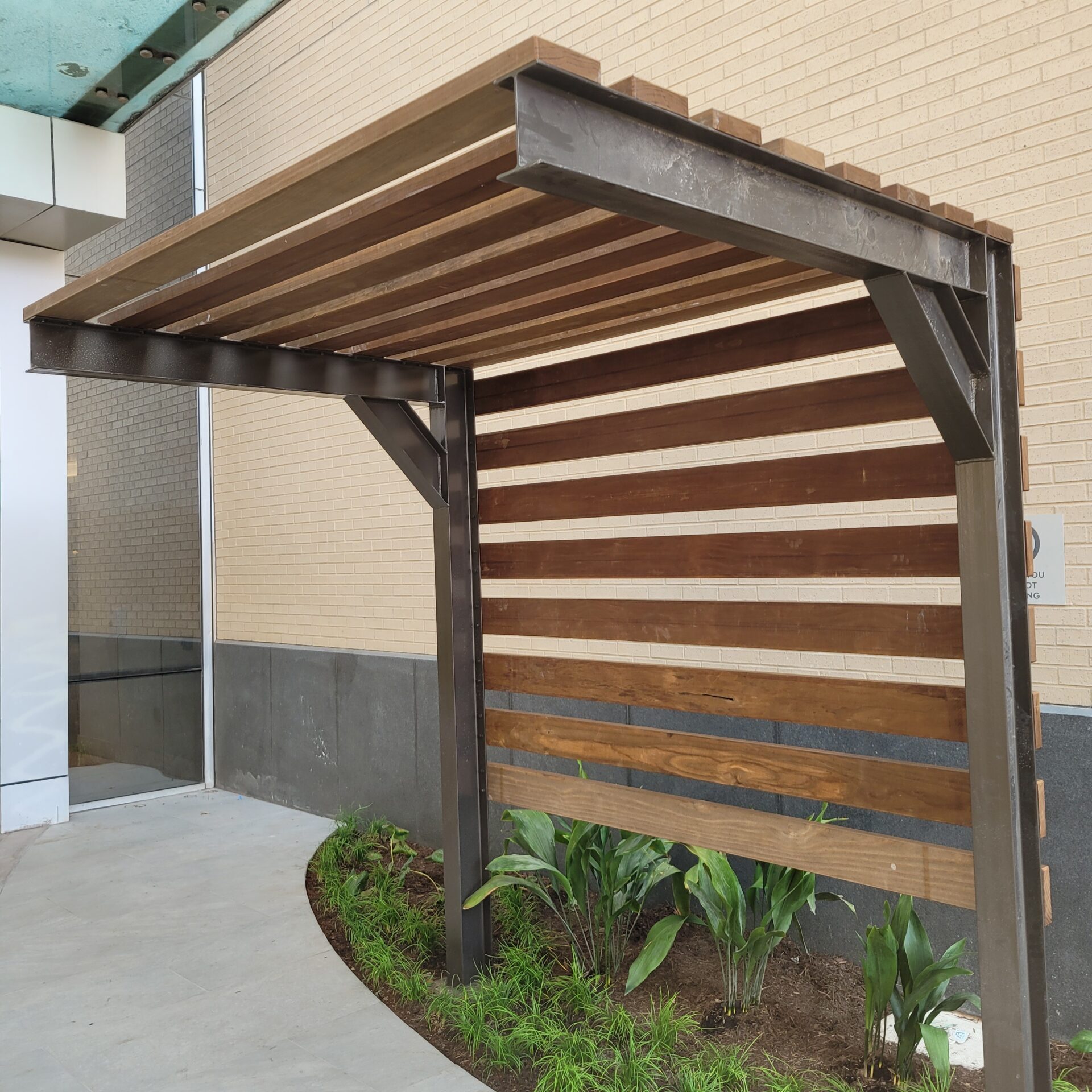 Custom metal fabricated bench overhang at Galleria